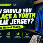 A professional text banner graphic for a 2026 gear maintenance guide article titled "When Should You Replace a Youth Goalie Jersey? The Honest Guide."